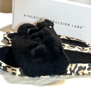 APL Black Fur lined Slides with Leopard Print Sole in women’s size 8.